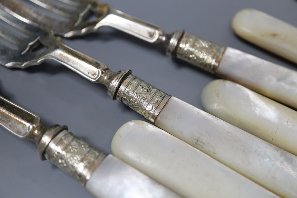 A pair of Edwardian silver ivory handled fish servers by Mappin & Webb, six pairs of ivory handled silver dessert eaters, etc.